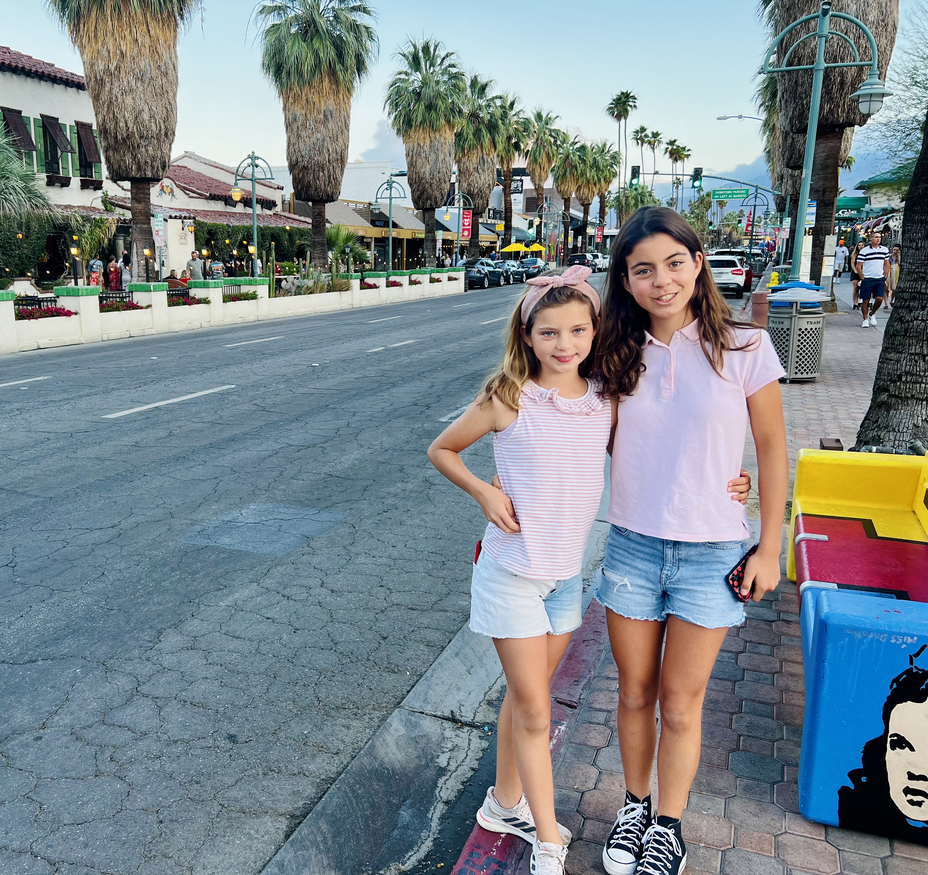 Img: female, girl, person, teen, shoe, hair, car, brown hair, wallet, curly hair