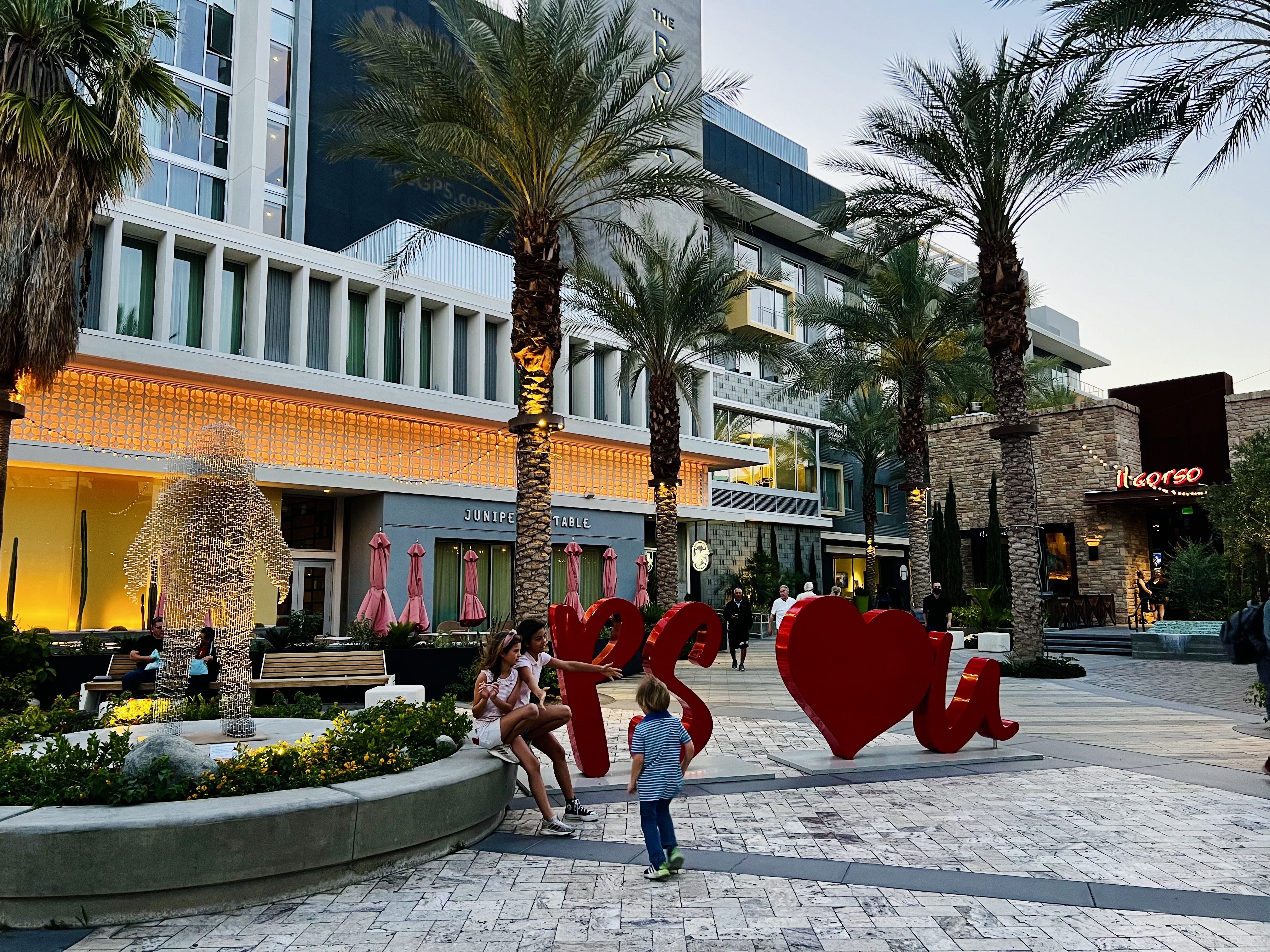 Img: person, people, bench, furniture, plant, tree, neighborhood, city, symbol, handbag