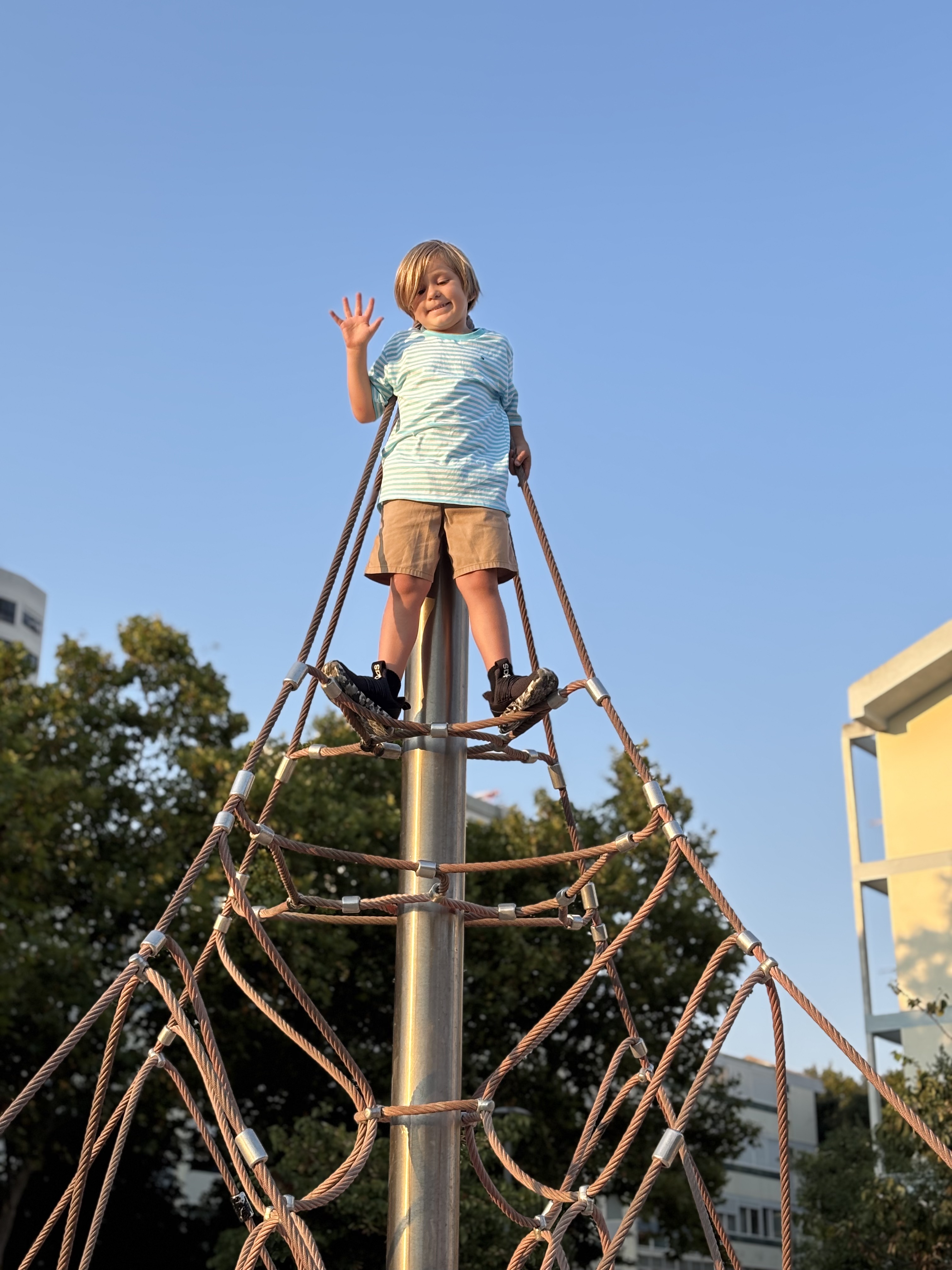 Img: clothing, footwear, shoe, person, outdoors, play area, outdoor play area