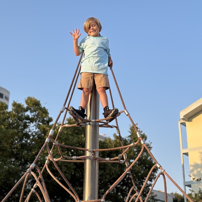 Img: clothing, footwear, shoe, person, outdoors, play area, outdoor play area
