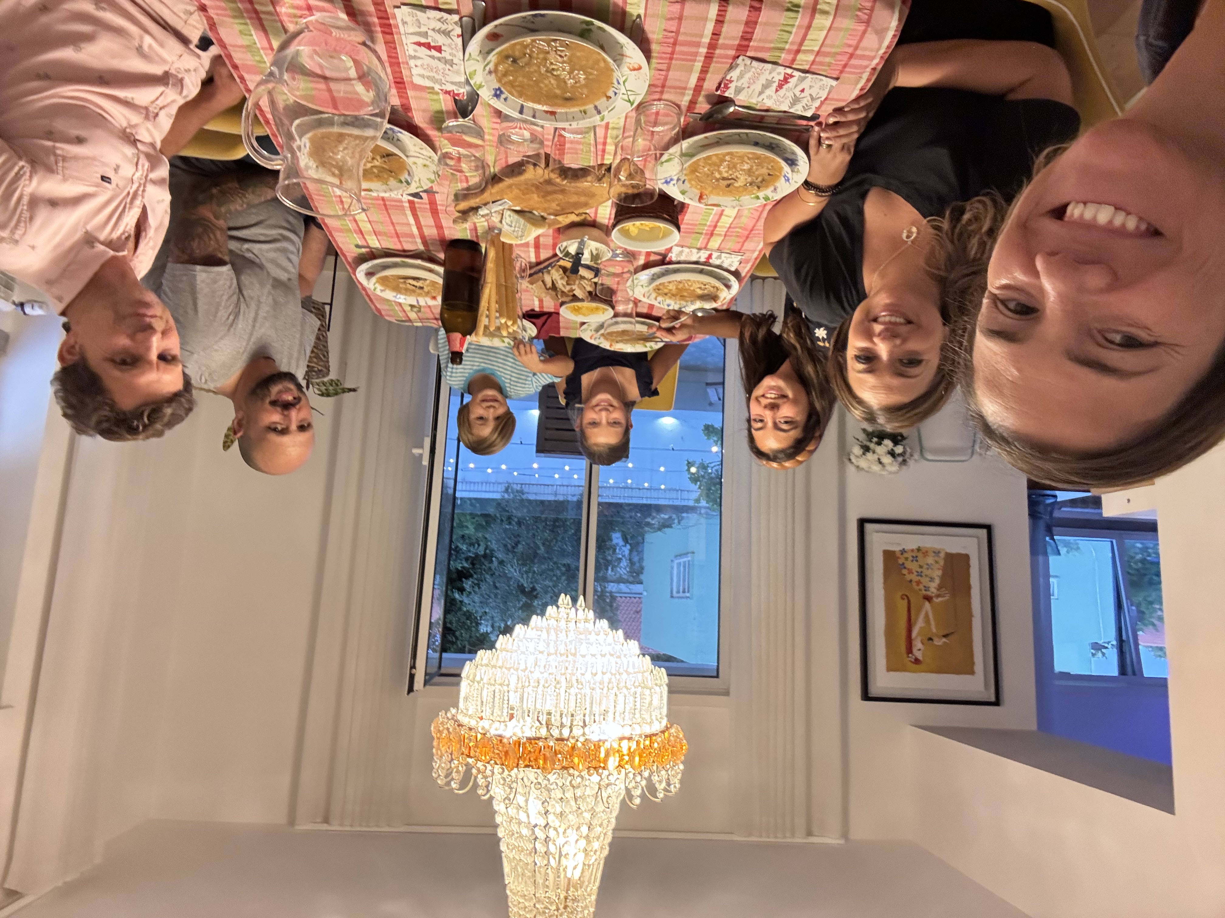 Img: dining room, dining table, table, people, person, chandelier, adult, female, woman, man