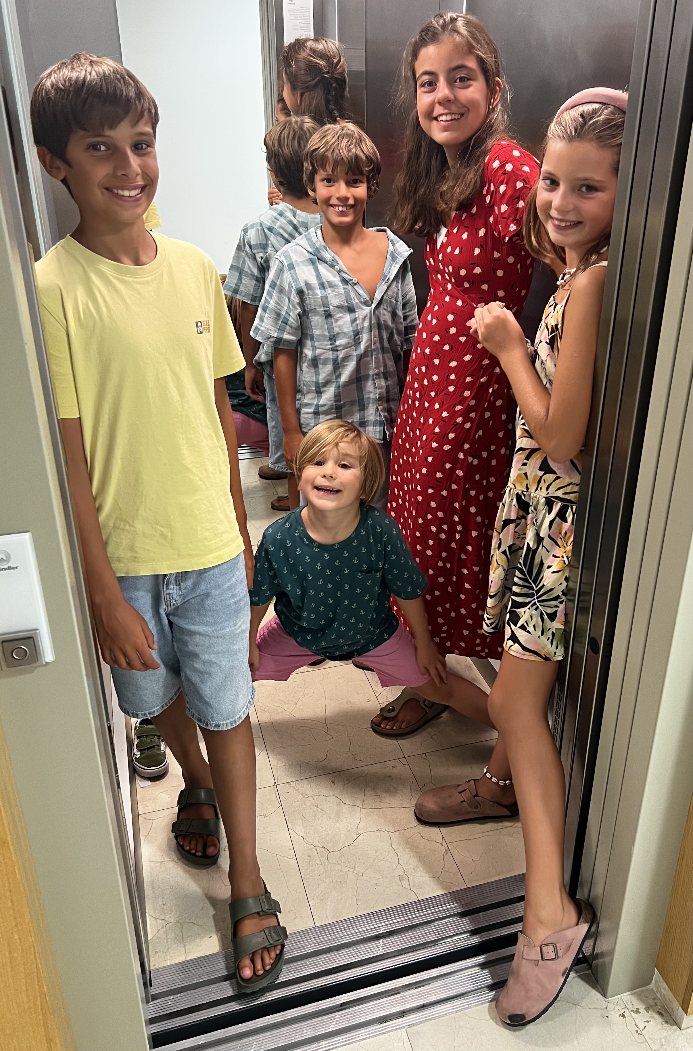 Img: person, footwear, shoe, sandal, child, female, girl, high heel, necklace, indoors