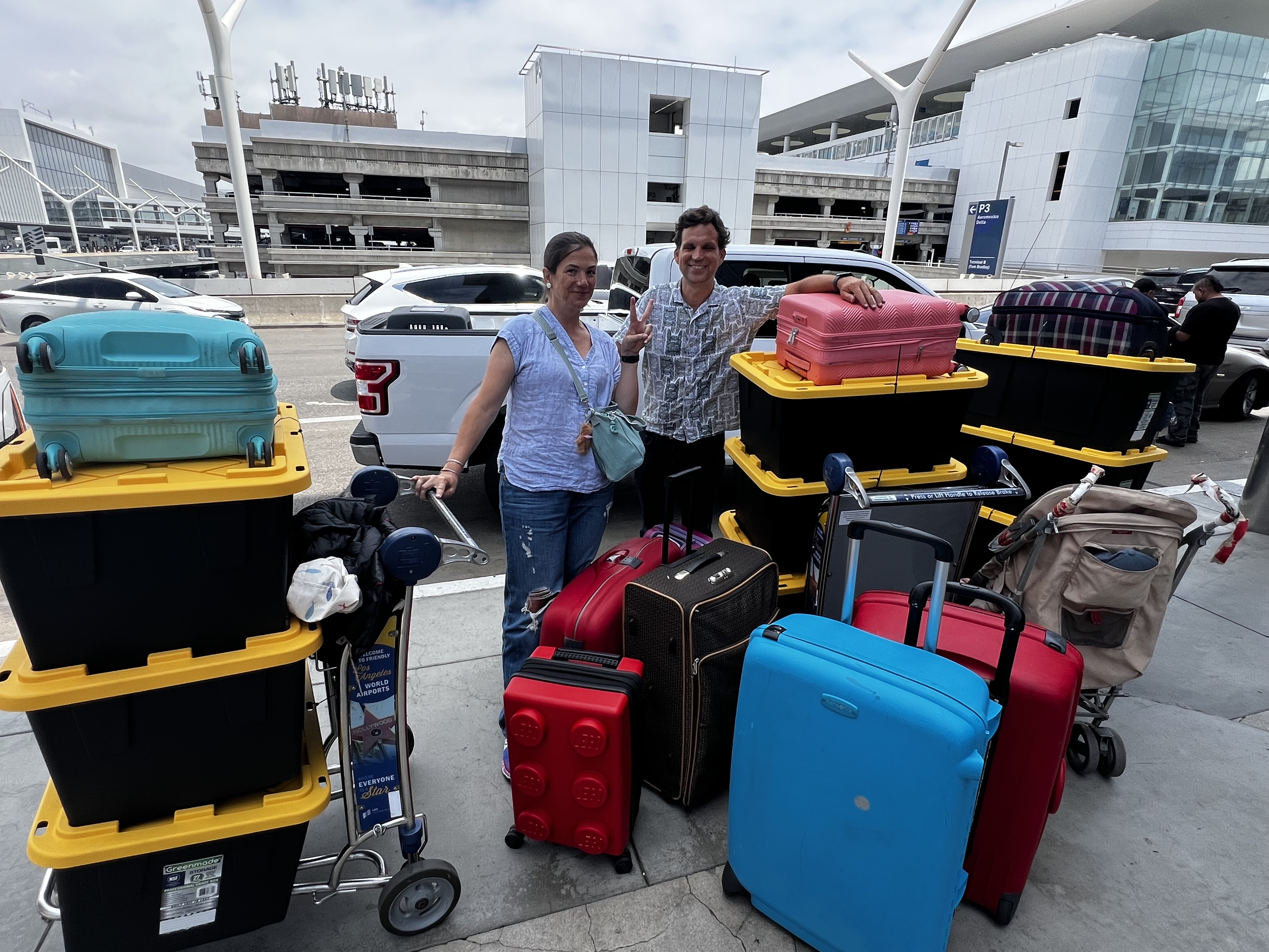 Img: bag, handbag, baggage, adult, male, man, person, box, car, suitcase