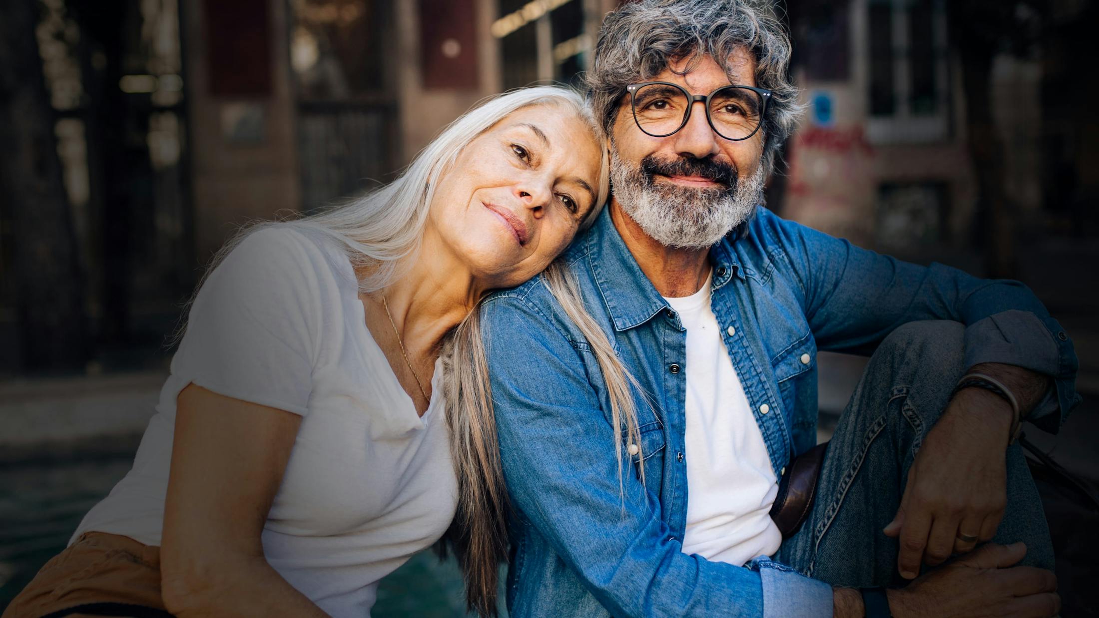 woman with her head on a man's sgoulder