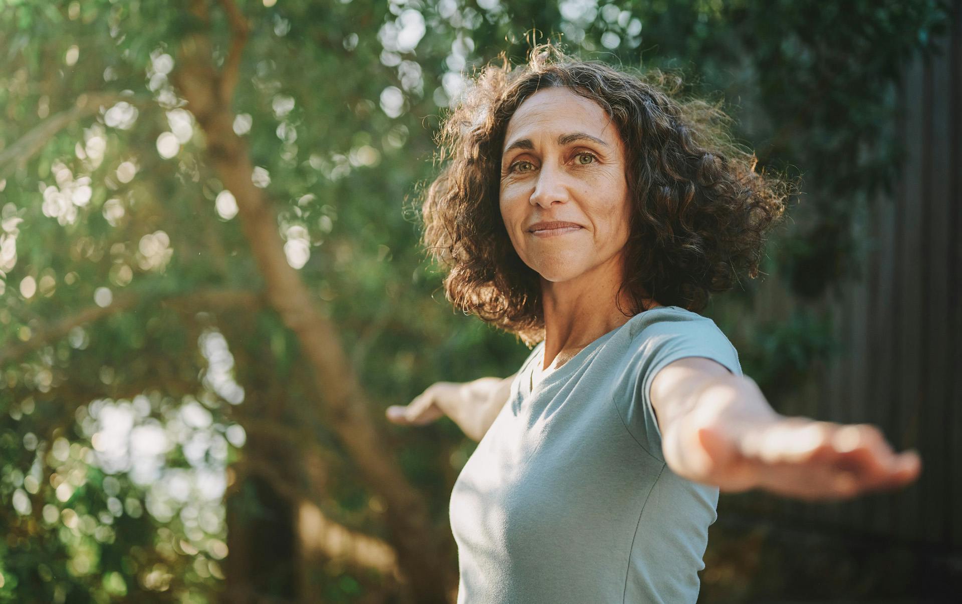 Woman stretching out her arms.