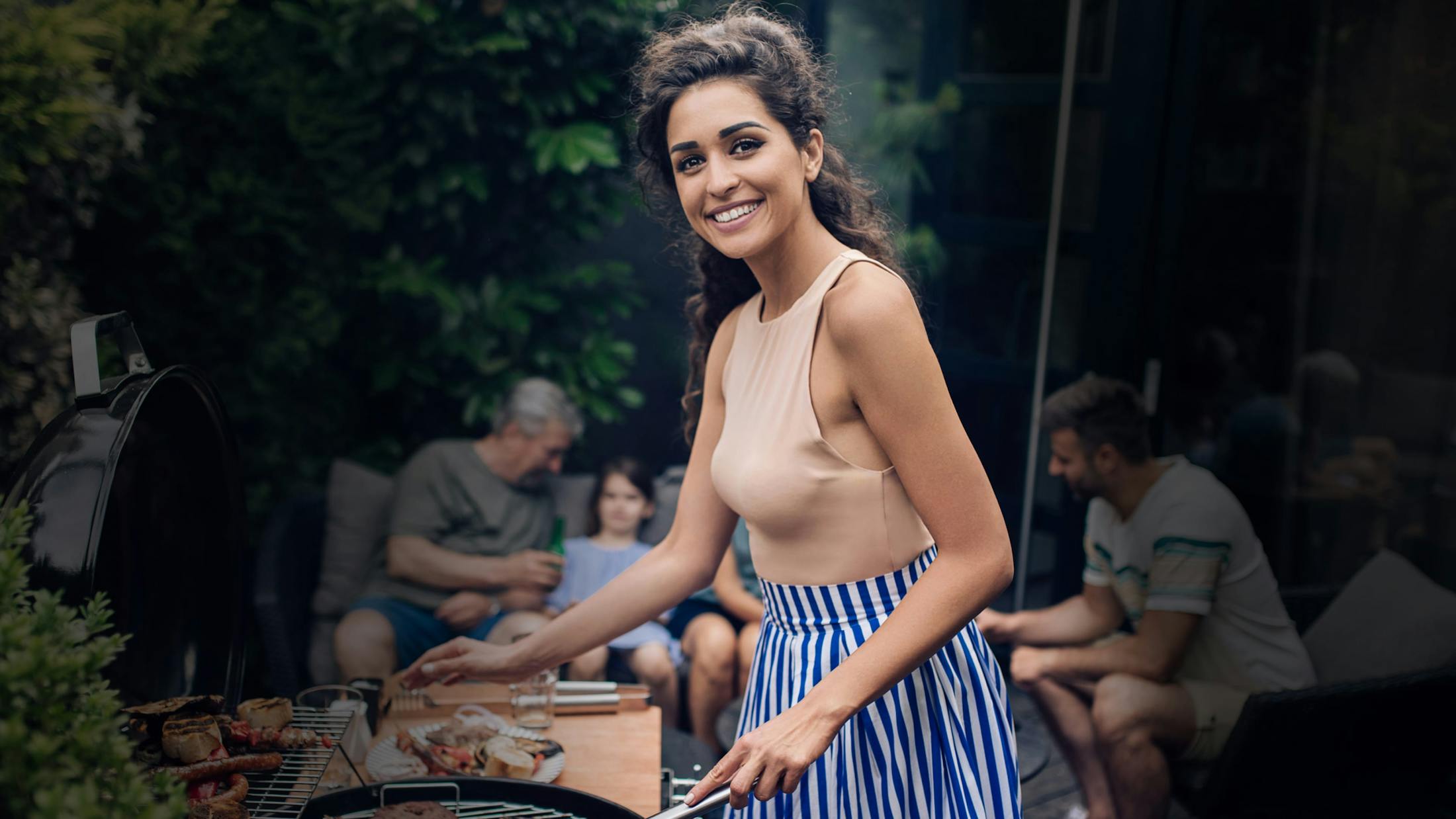 Pretty woman barbecuing