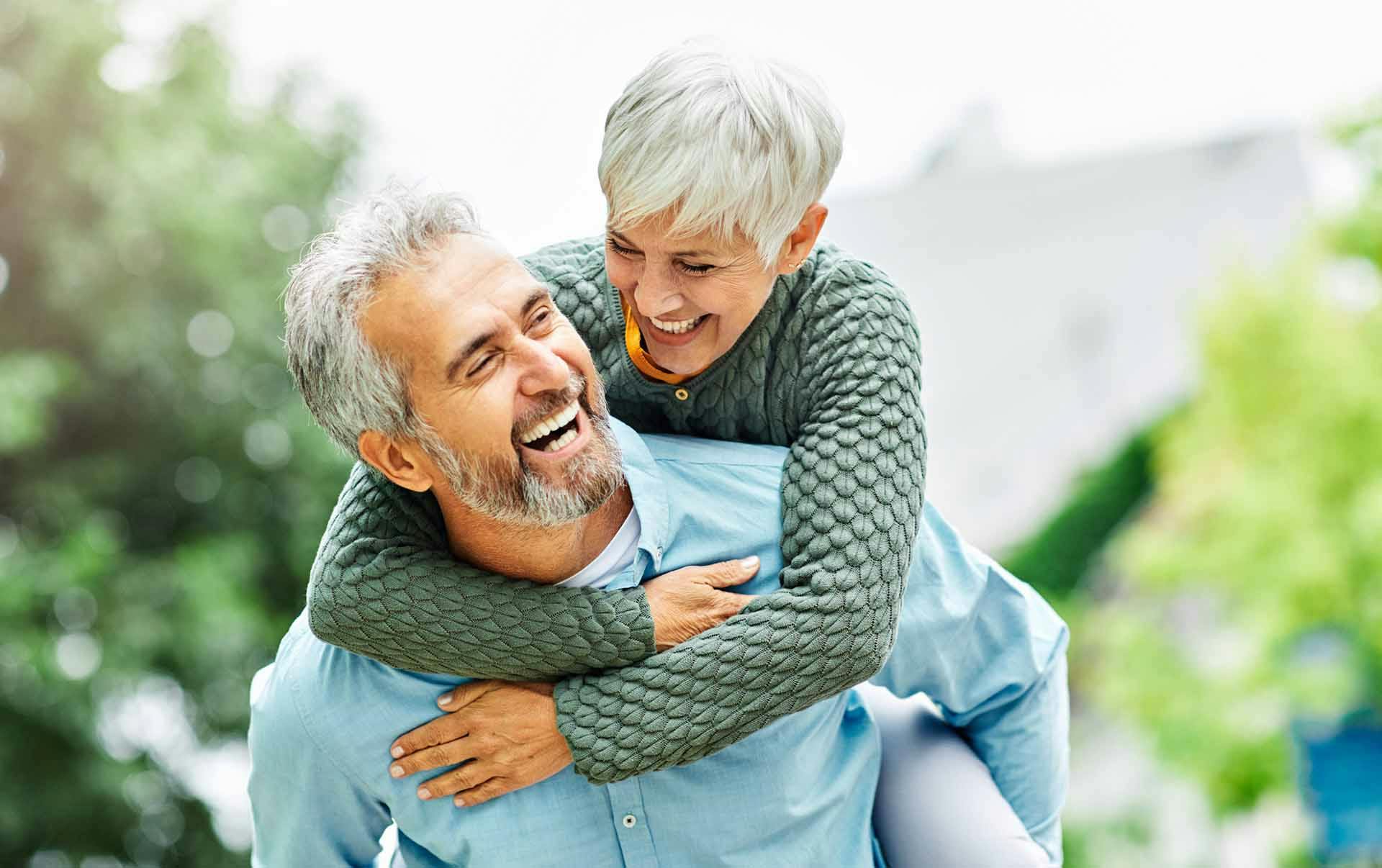 Older Woman and Man Laughing - Anti-Aging Supplementation Banner