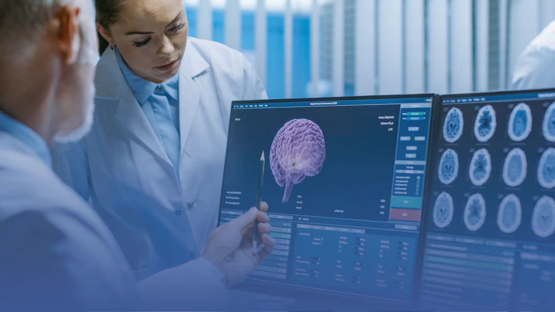 Two doctors looking at a brain scan