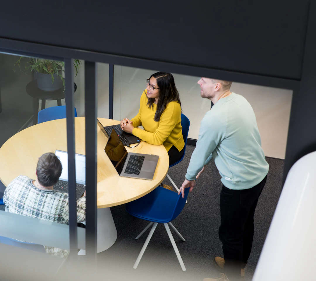 Hidex colleagues exchange ideas during a team meeting