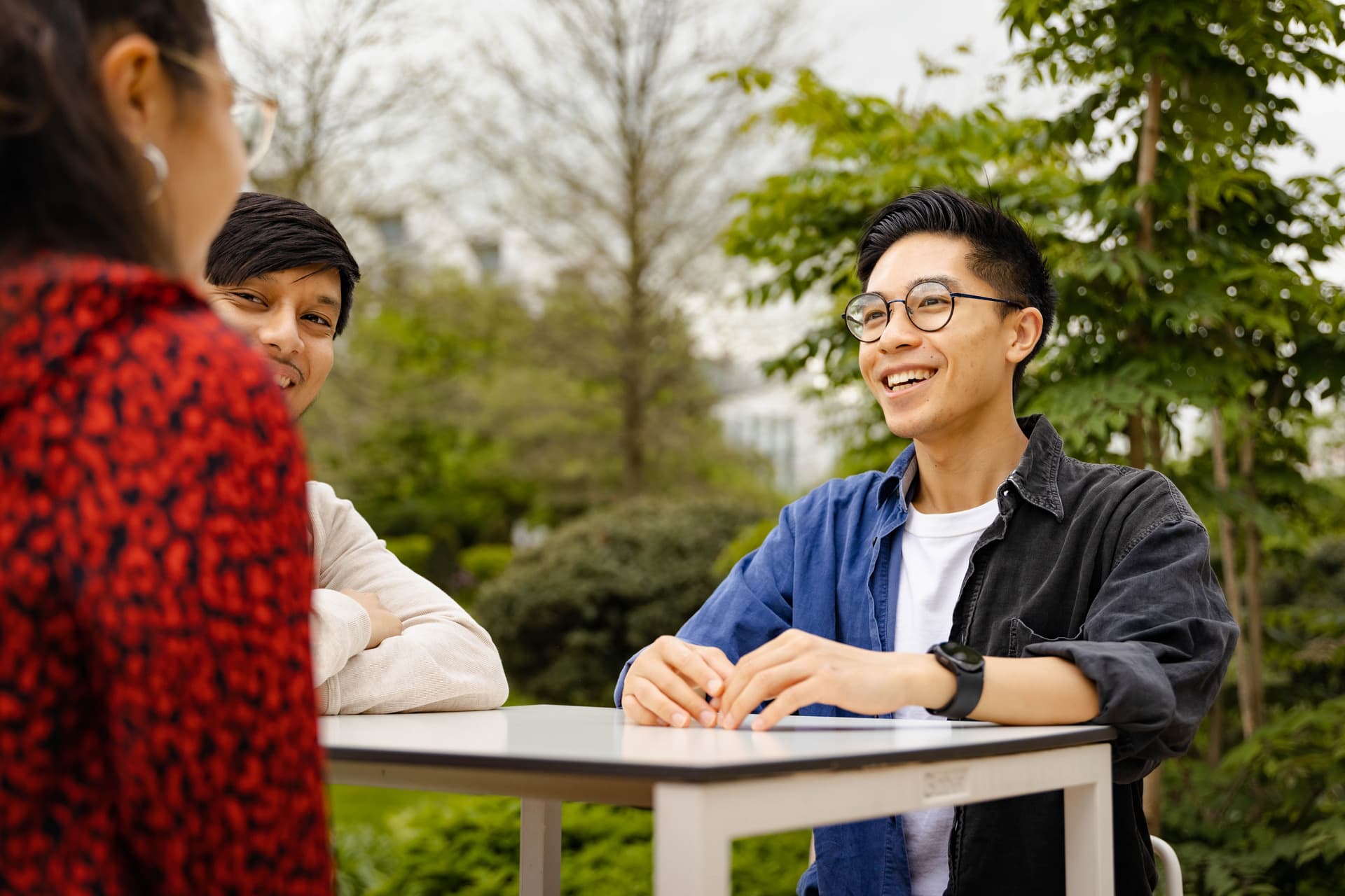 Group of graduates talking outside