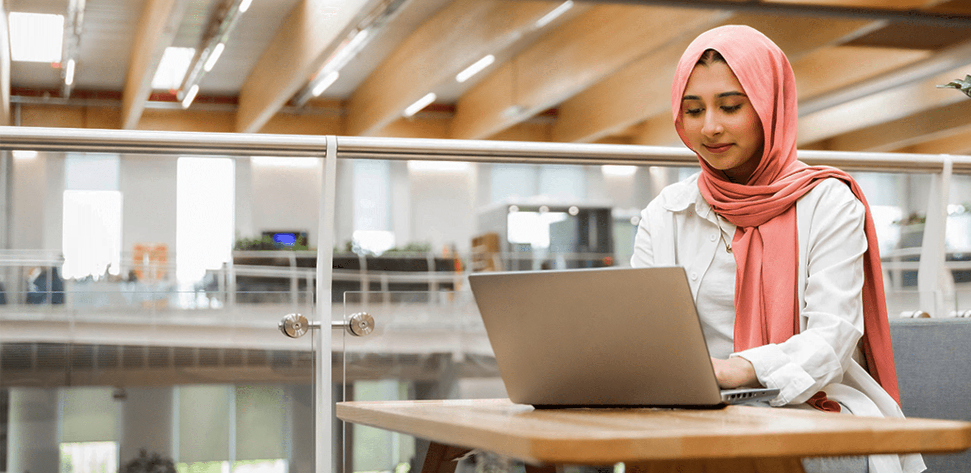 Girl working on laptop.