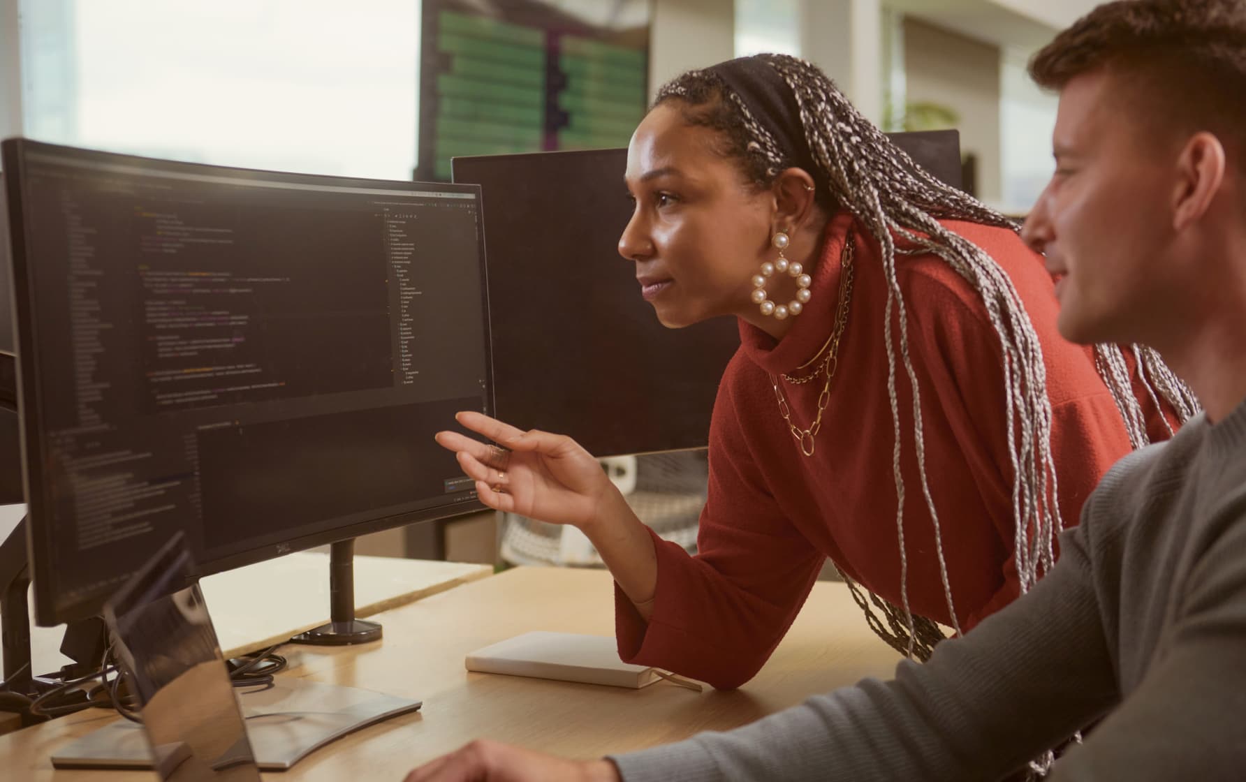two people looking at a computer screen