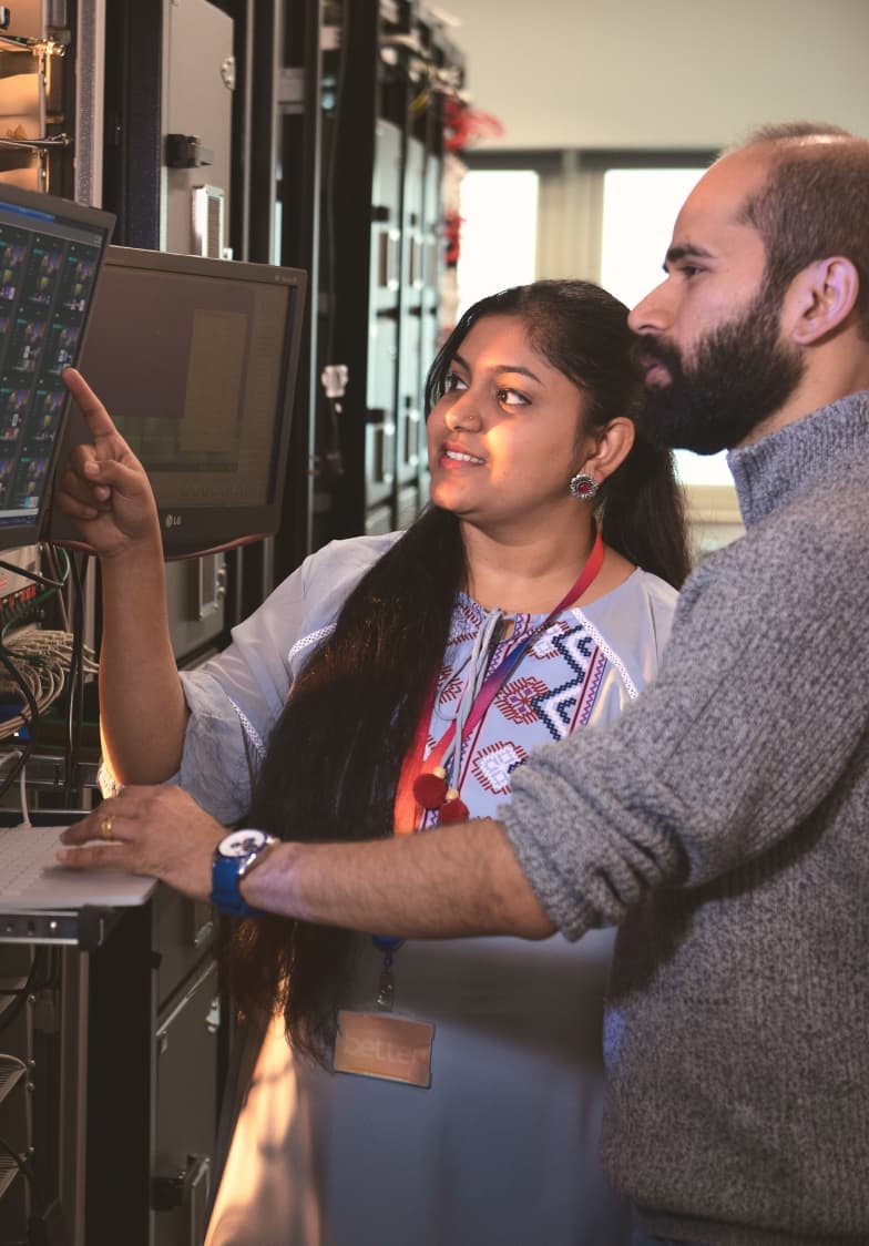 two people looking at a screen