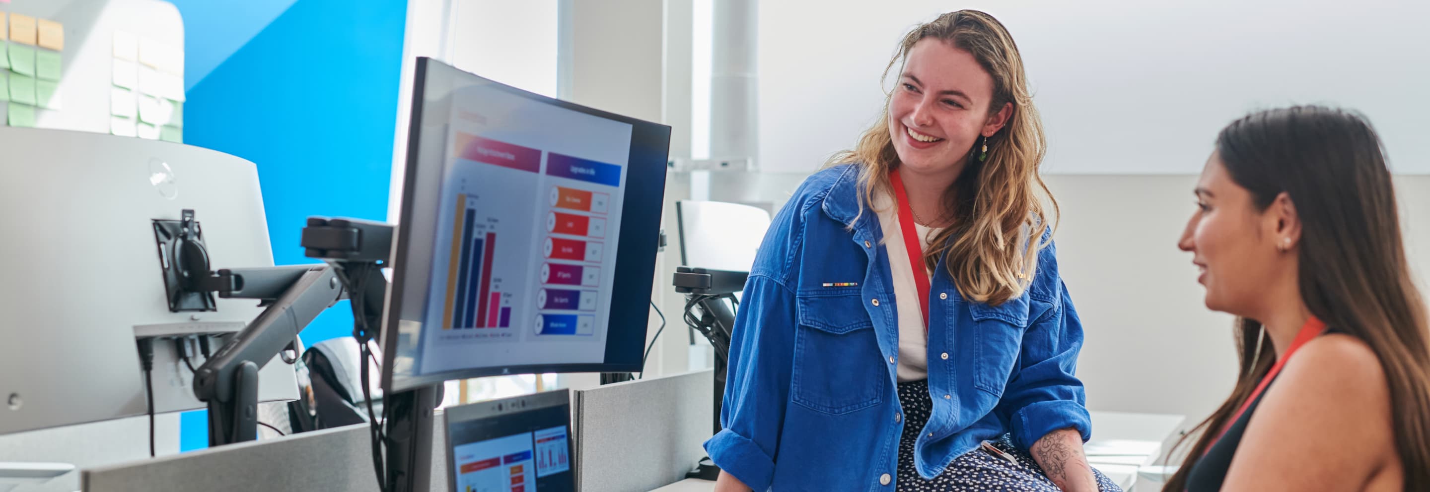 two women looking at a computer monitor