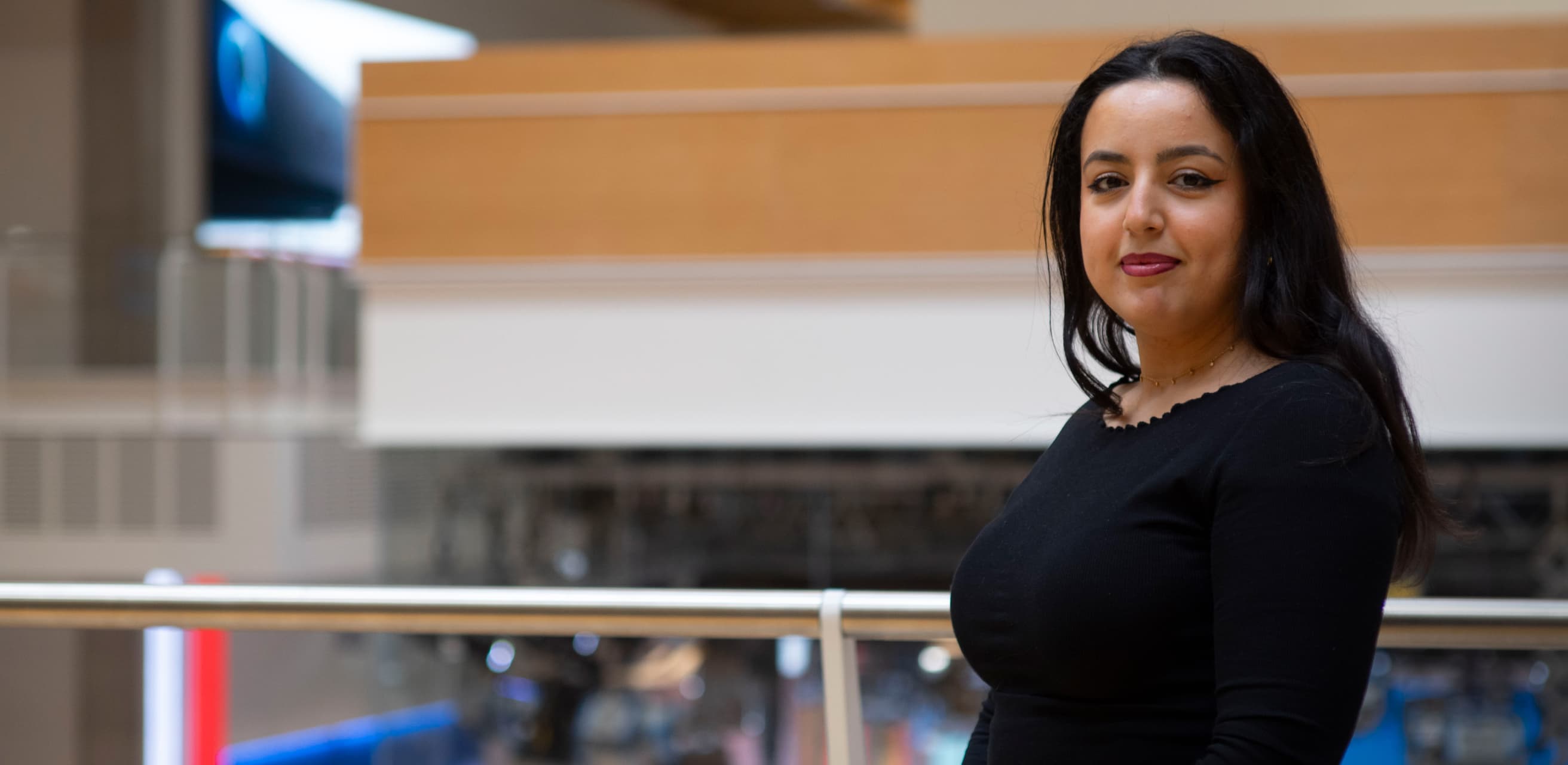 woman with black hair in a black top