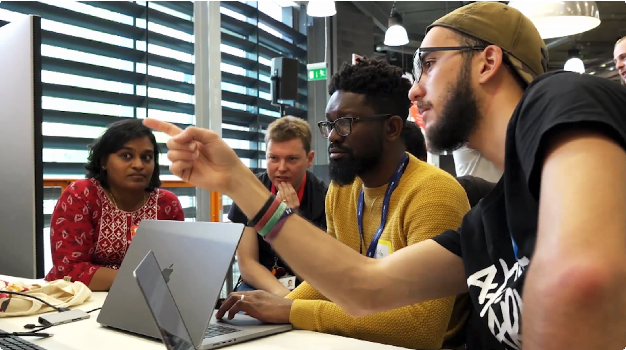 group of grads all looking at a screen