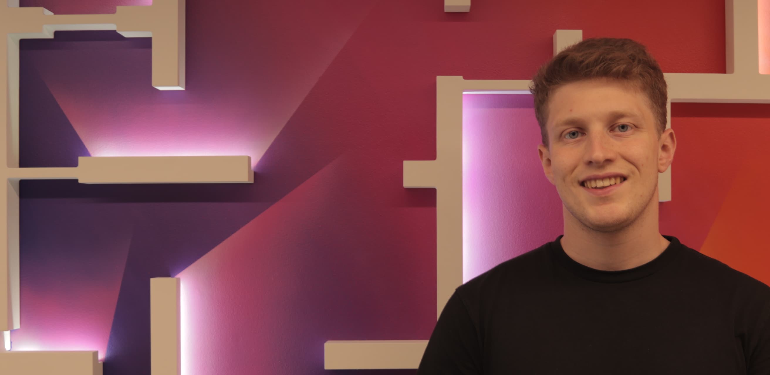 man with short hair smiling