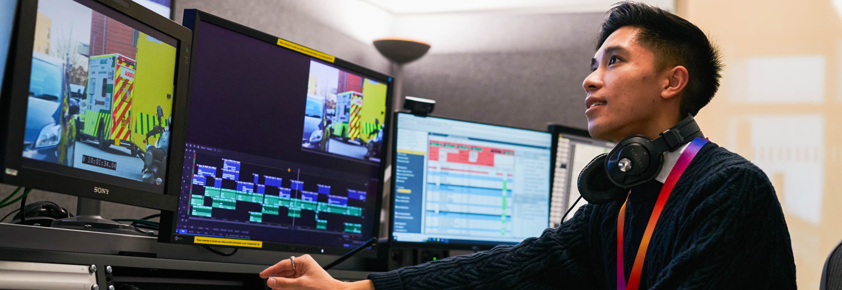 an east asian man editing a video