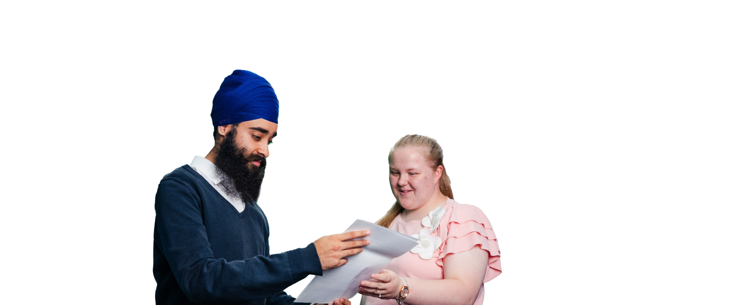 Man showing papers to a smiling woman in a ruffled pink top, both engaged in discussion.