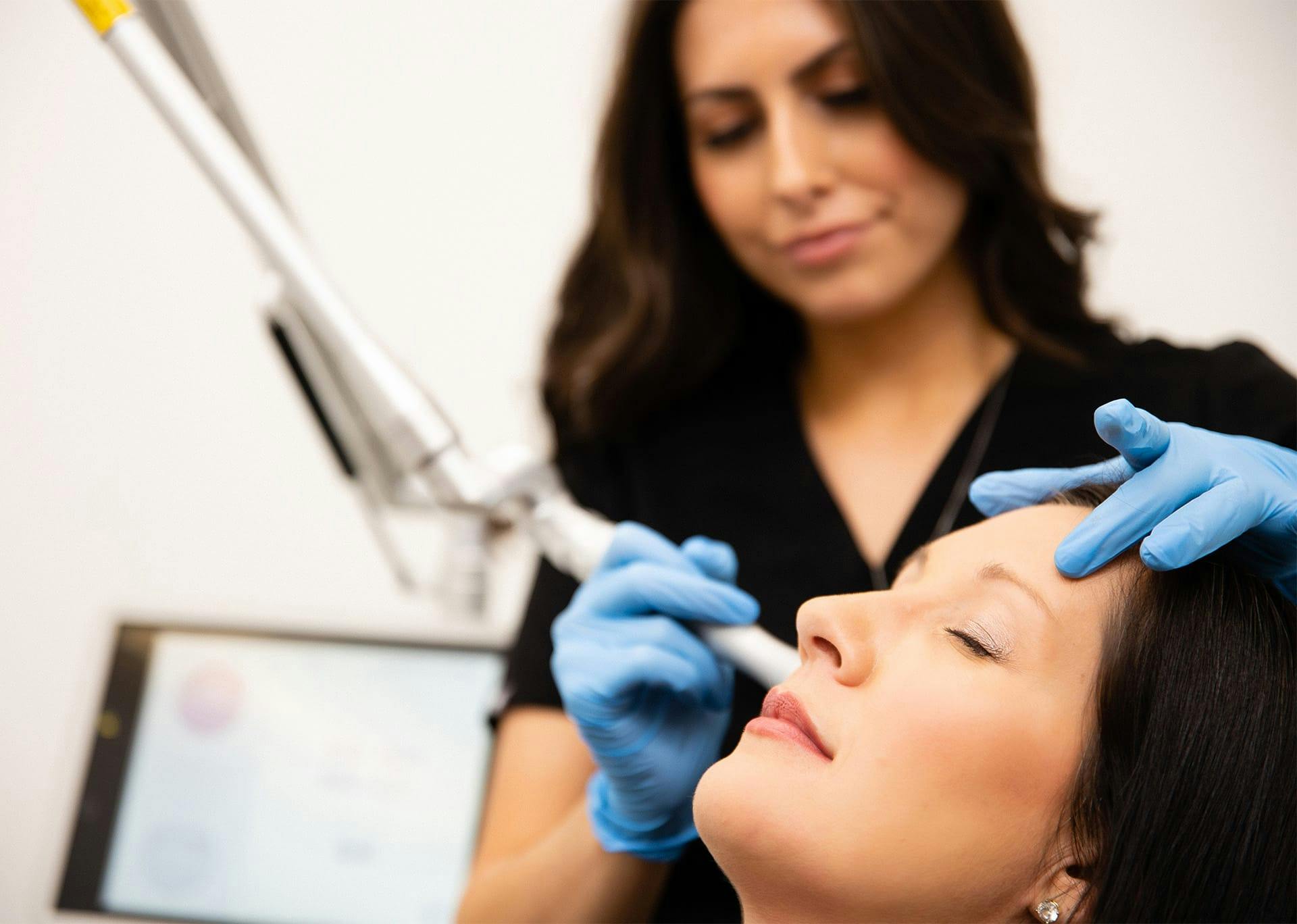 Jocelyn using co2 laser on patient