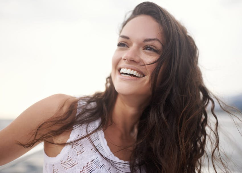 woman smiling at the beach