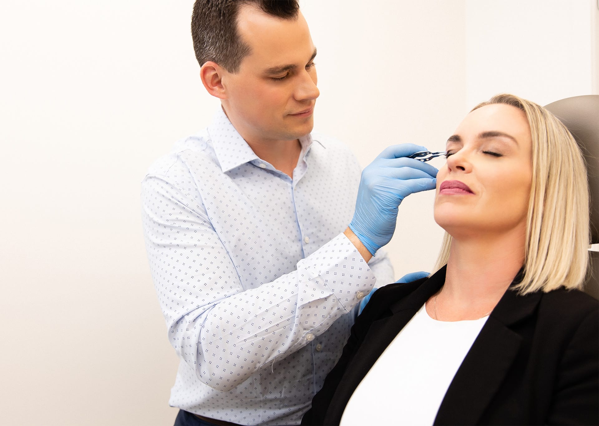 Dr. Brace preparing patient for eyelid surgery