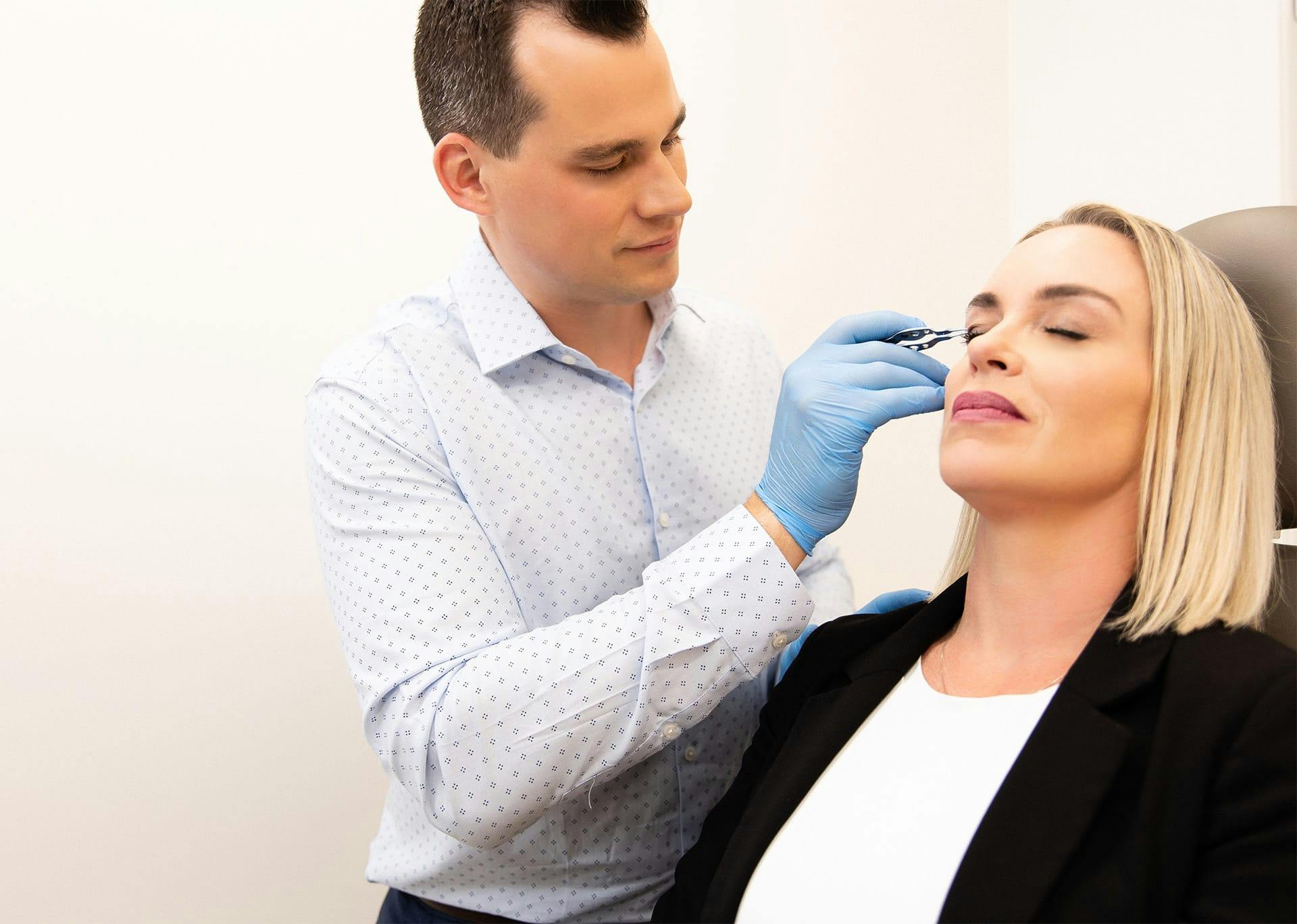 Dr. Brace preparing patient for eyelid surgery