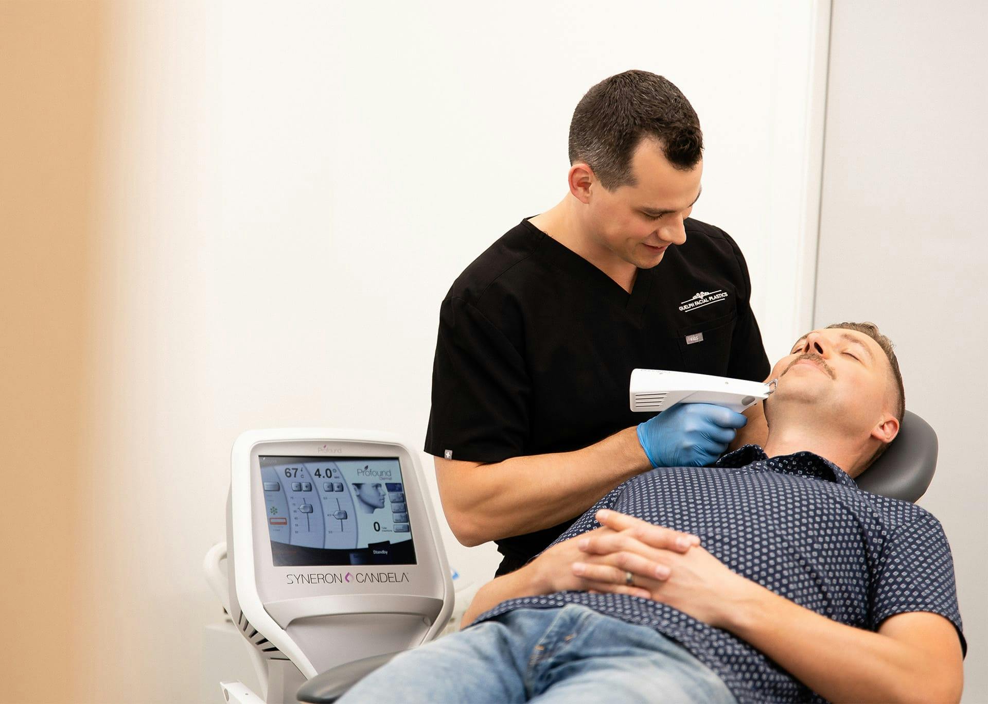 Dr. Brace using device on patient's skin