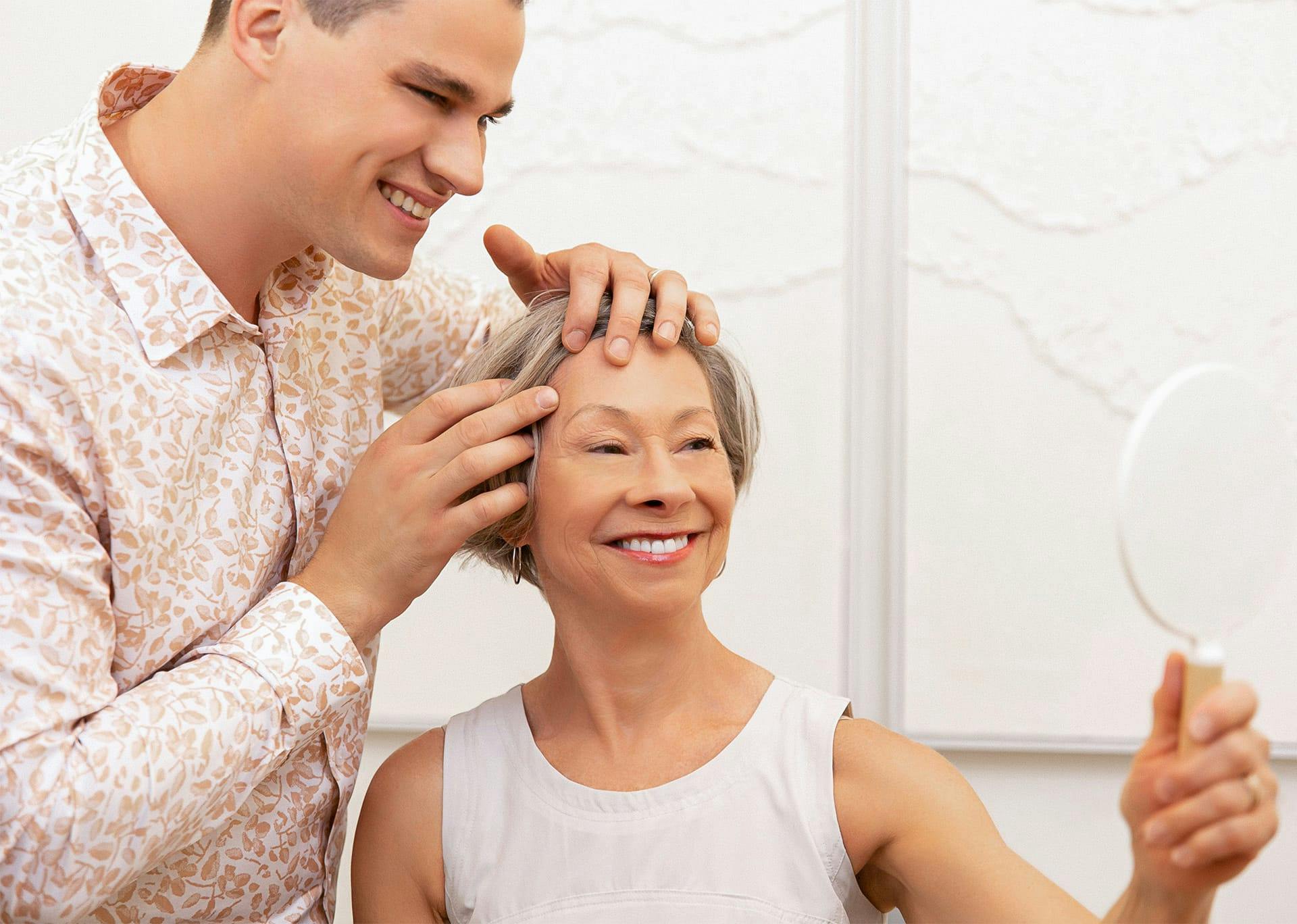 Dr. Brace helping smiling patient