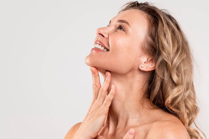 Woman with her hand under her chin