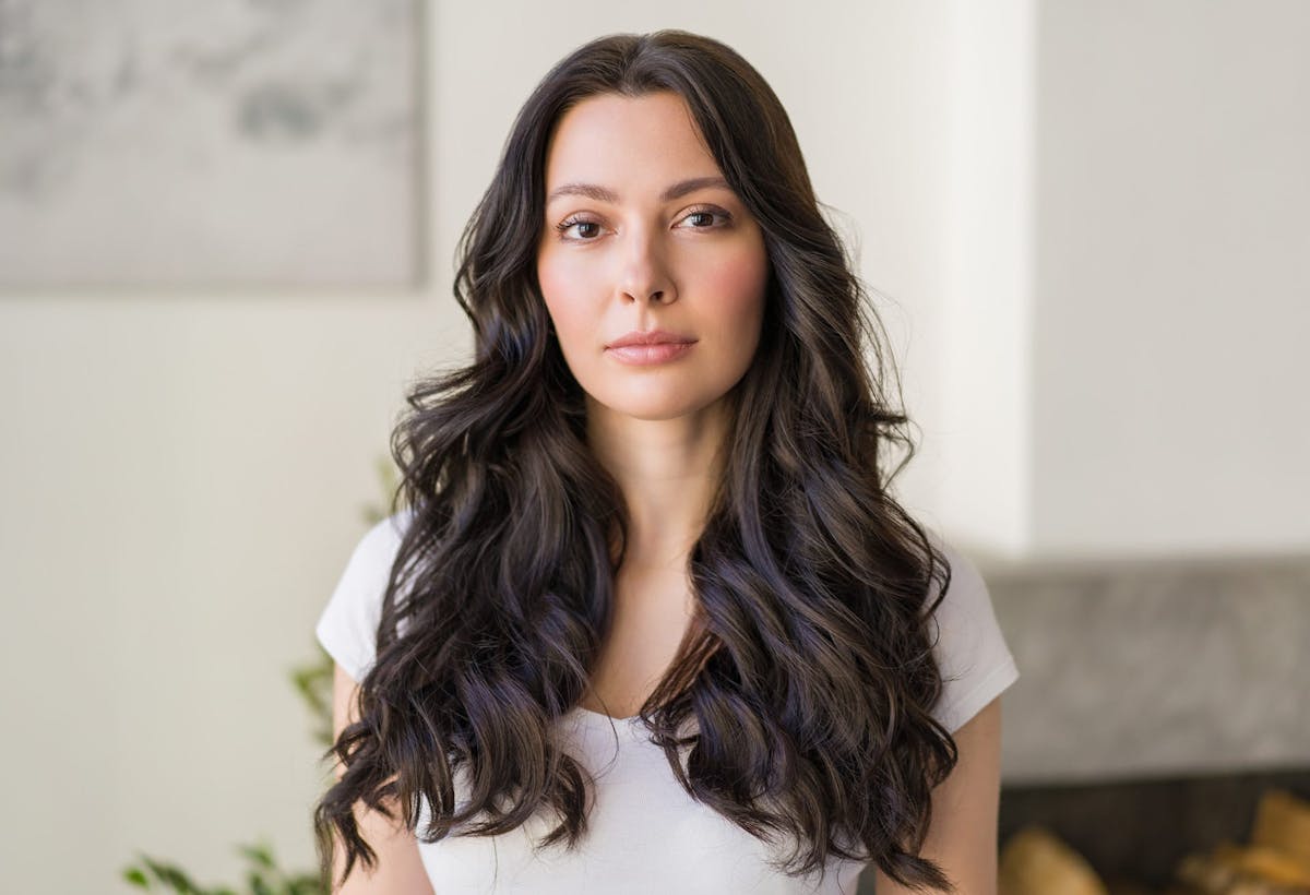 woman looking straight ahead in her living room