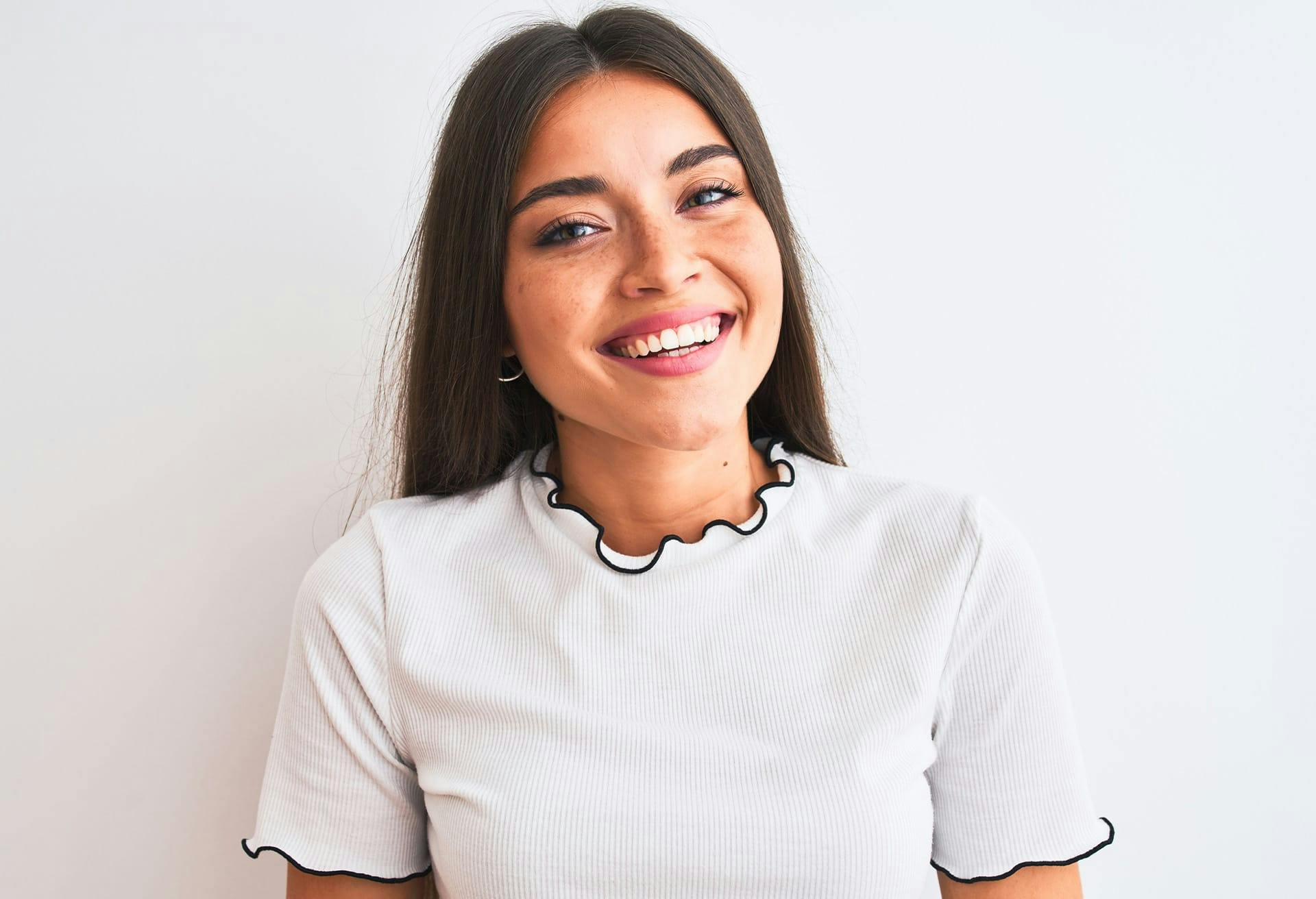 Woman with straight black hair, smiling