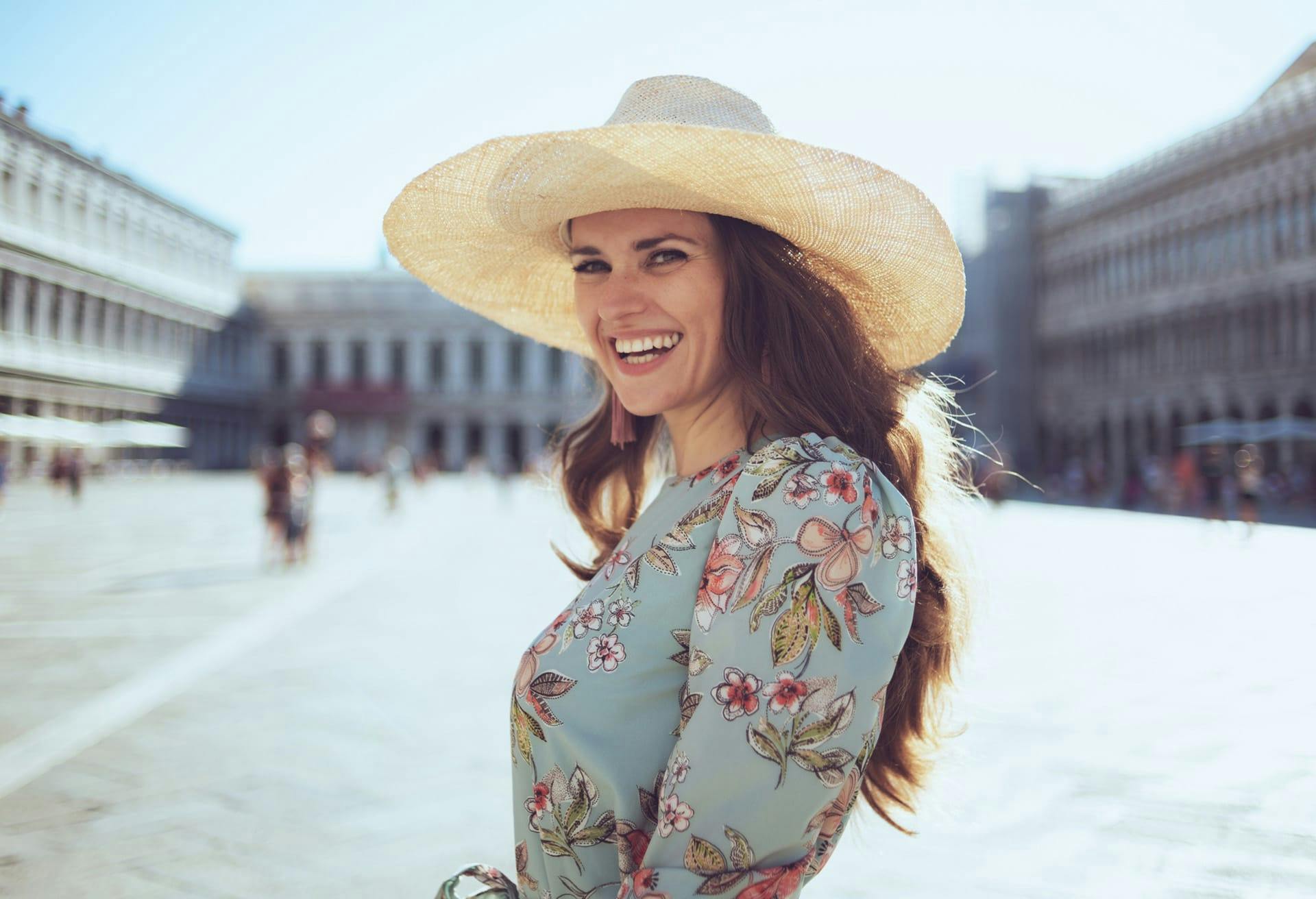 woman smiling in straw hat