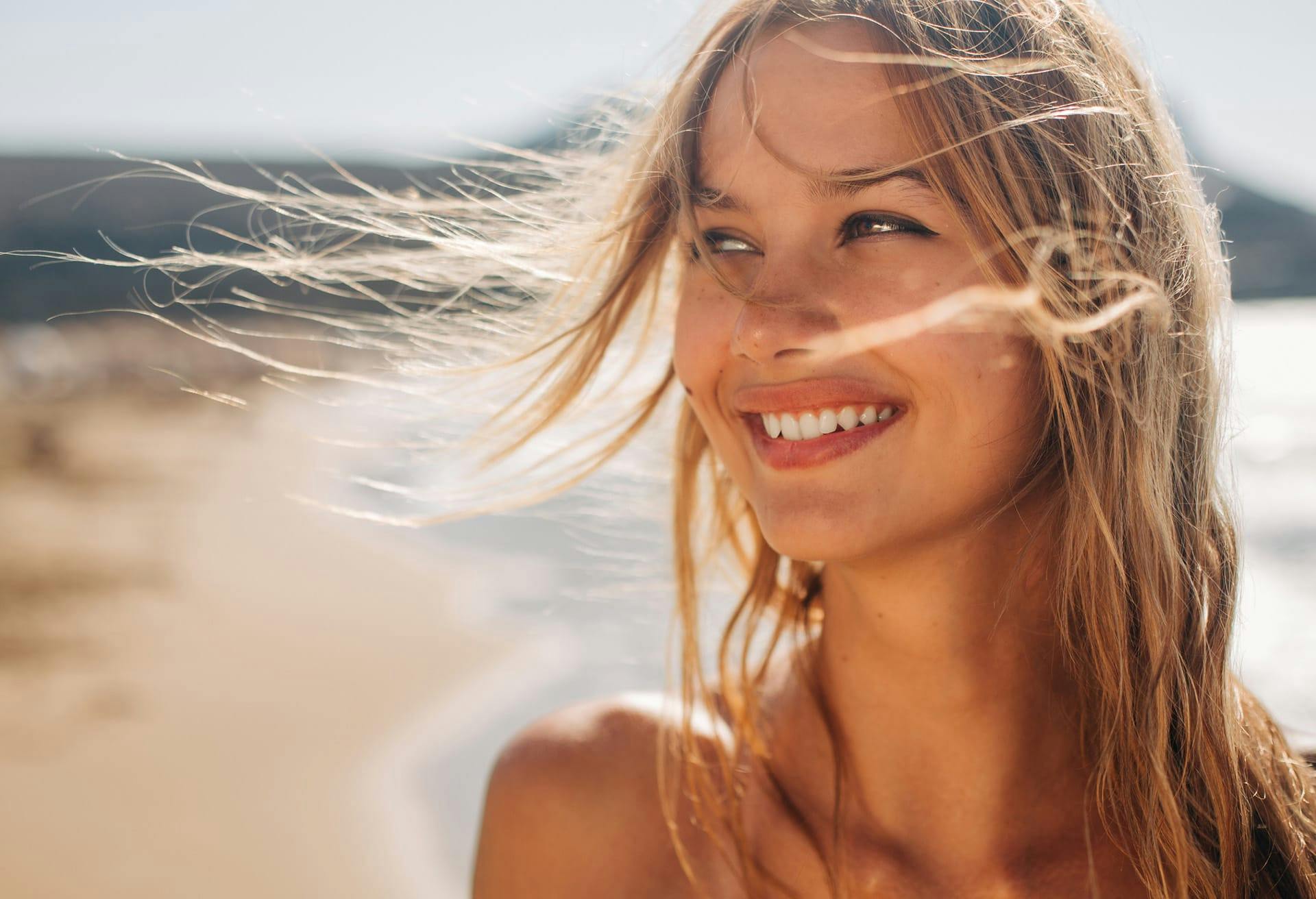 smiling woman on the beach