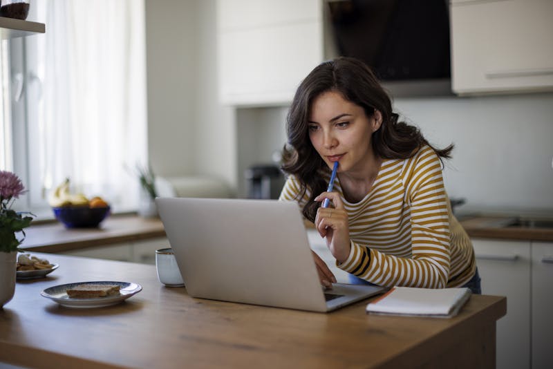 Woman looking at her laptop