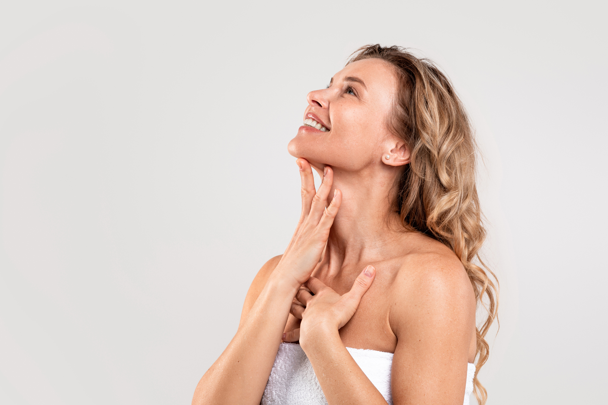 Woman touching her neck