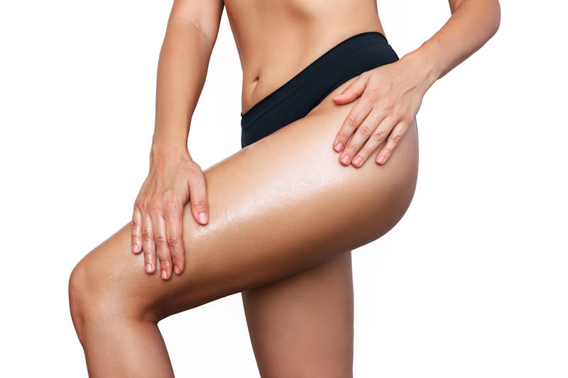 Woman touching her leg