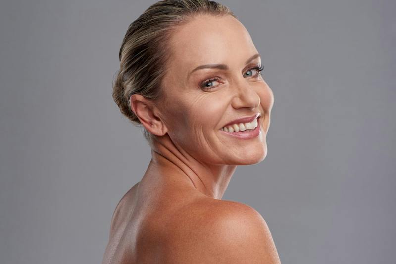 Woman with her hair up smiling