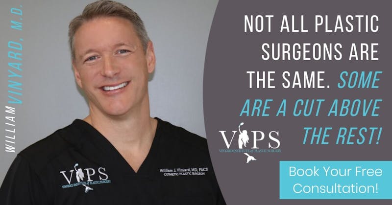 Dr. Vinyard smiling in scrubs