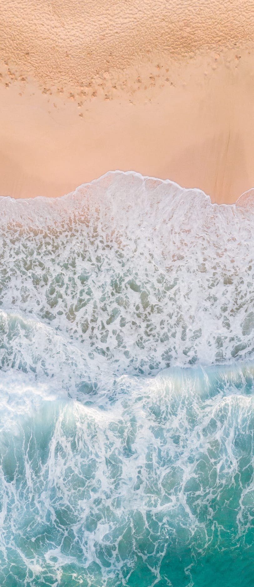 Water washing up on the shore.