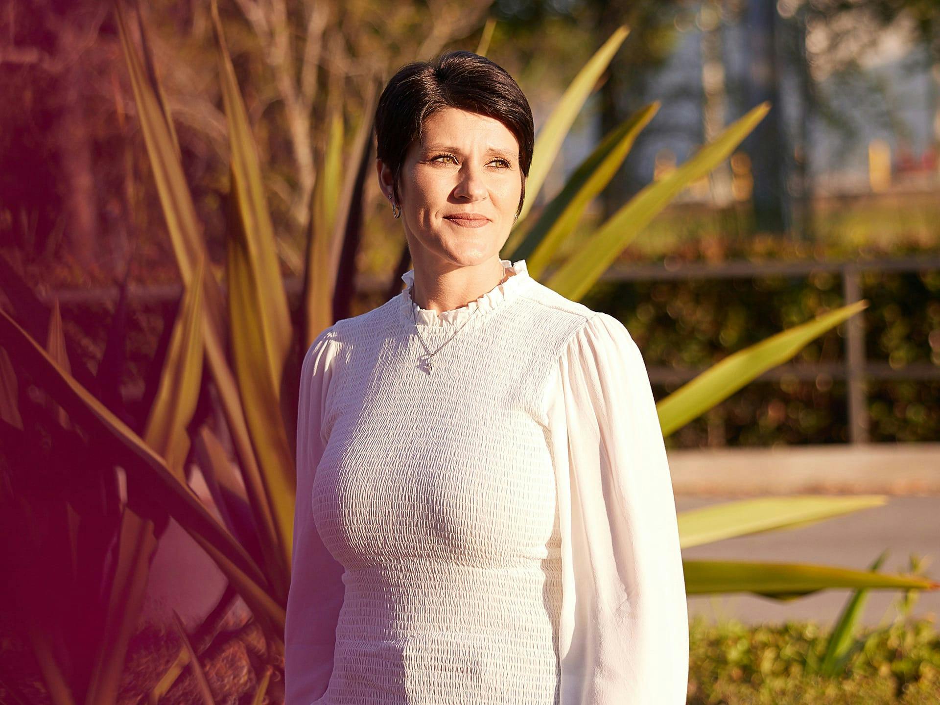Woman in a long sleeve white dress