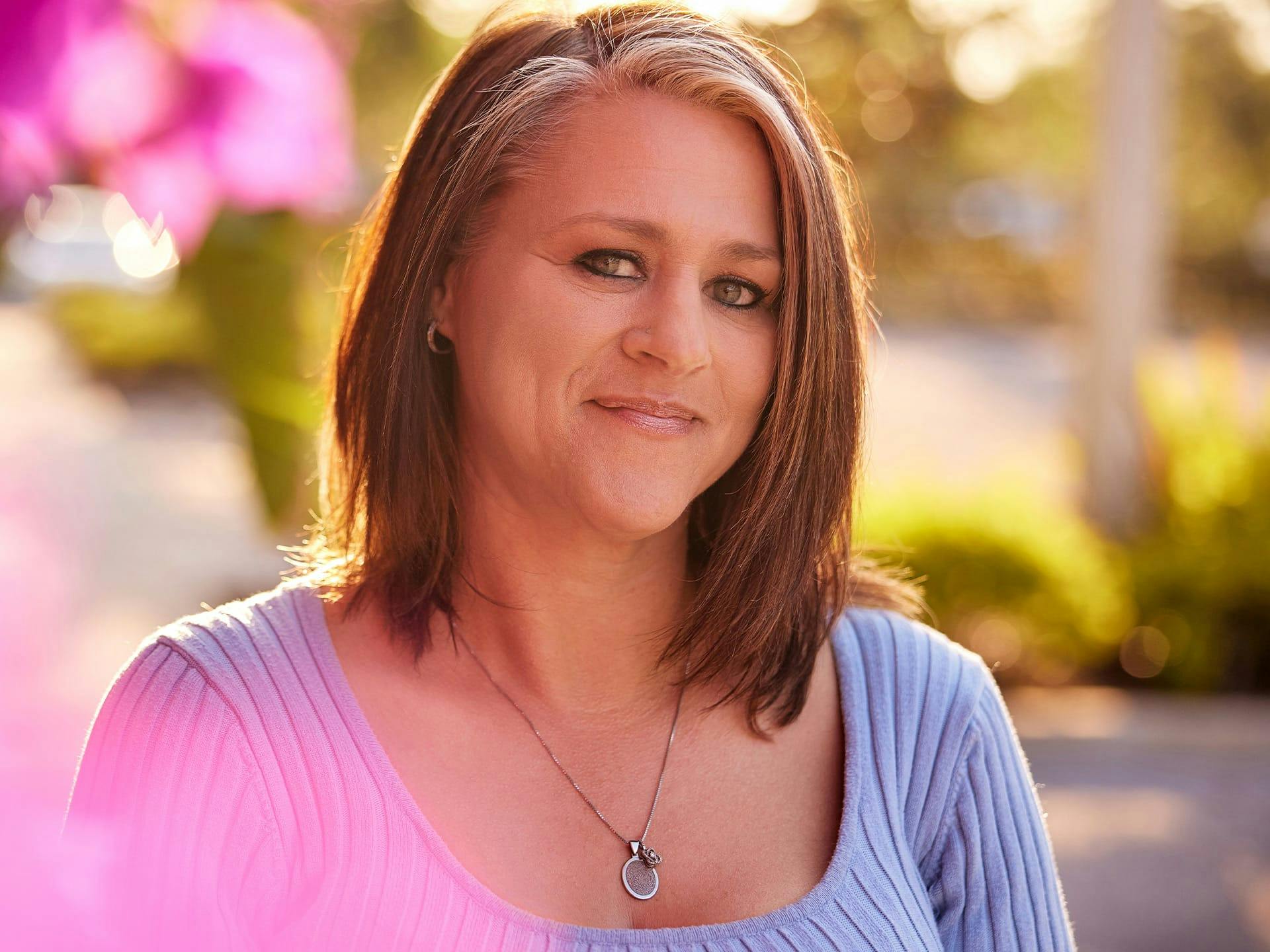 Woman outside smiling
