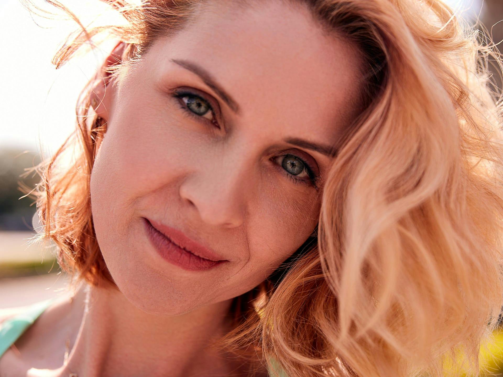 Woman with blonde hair smiling