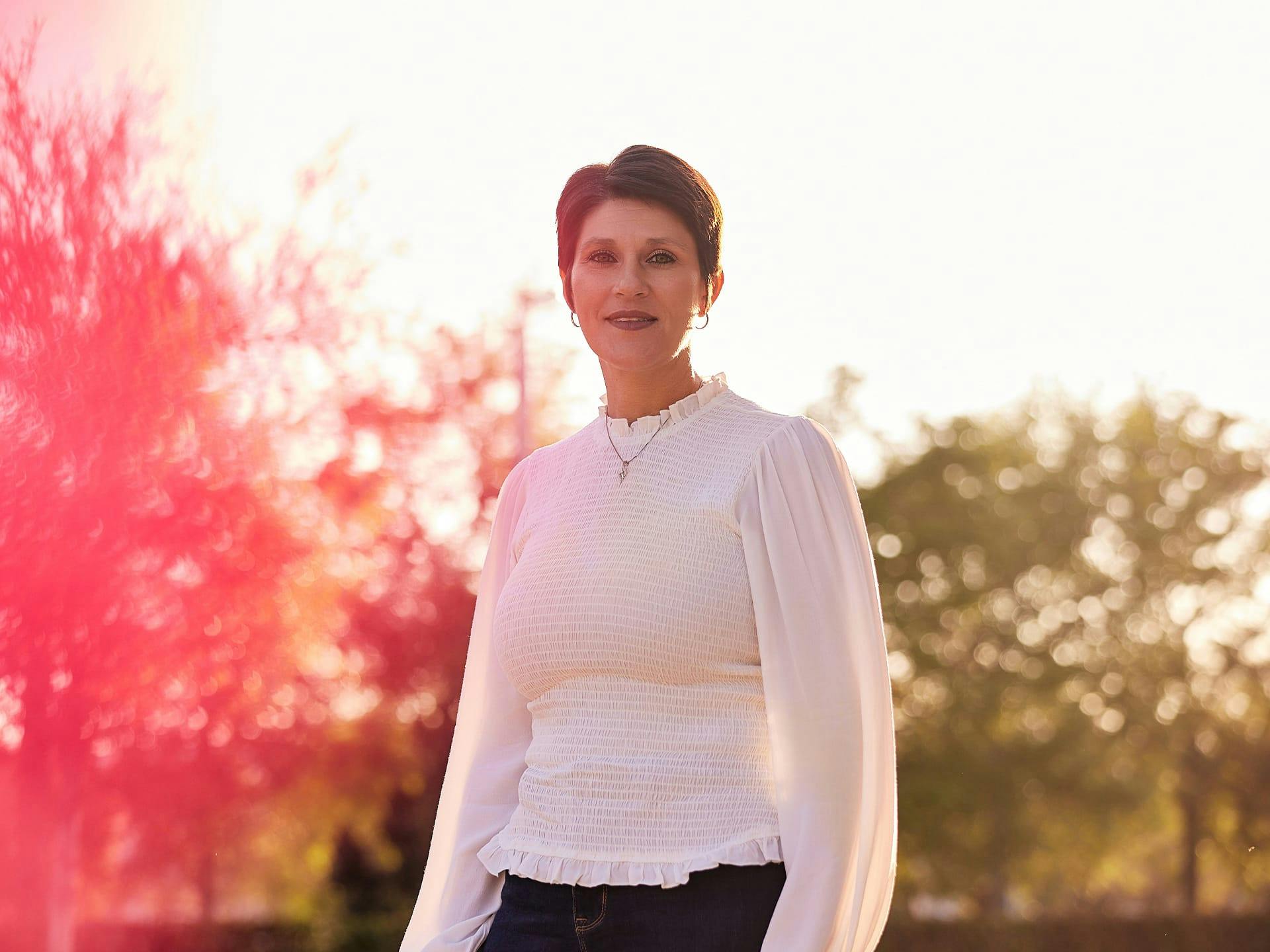 Woman in white long sleeve blouse