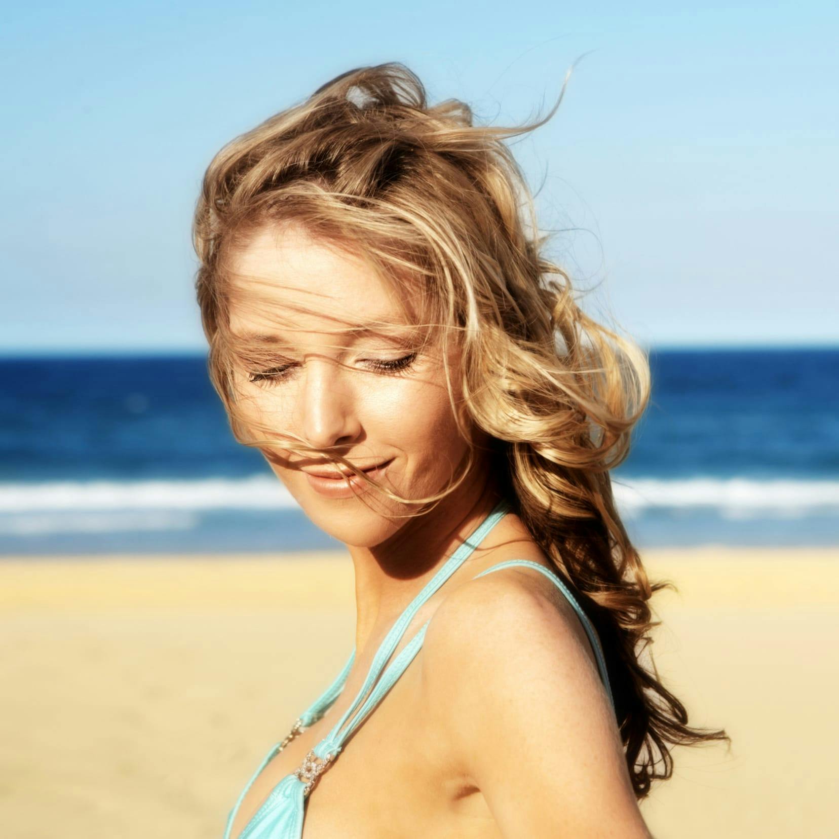 woman in blue bathing suit on beach