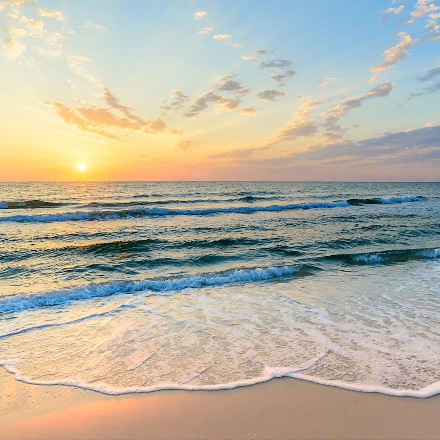 Beach at sunset with the water flowing out