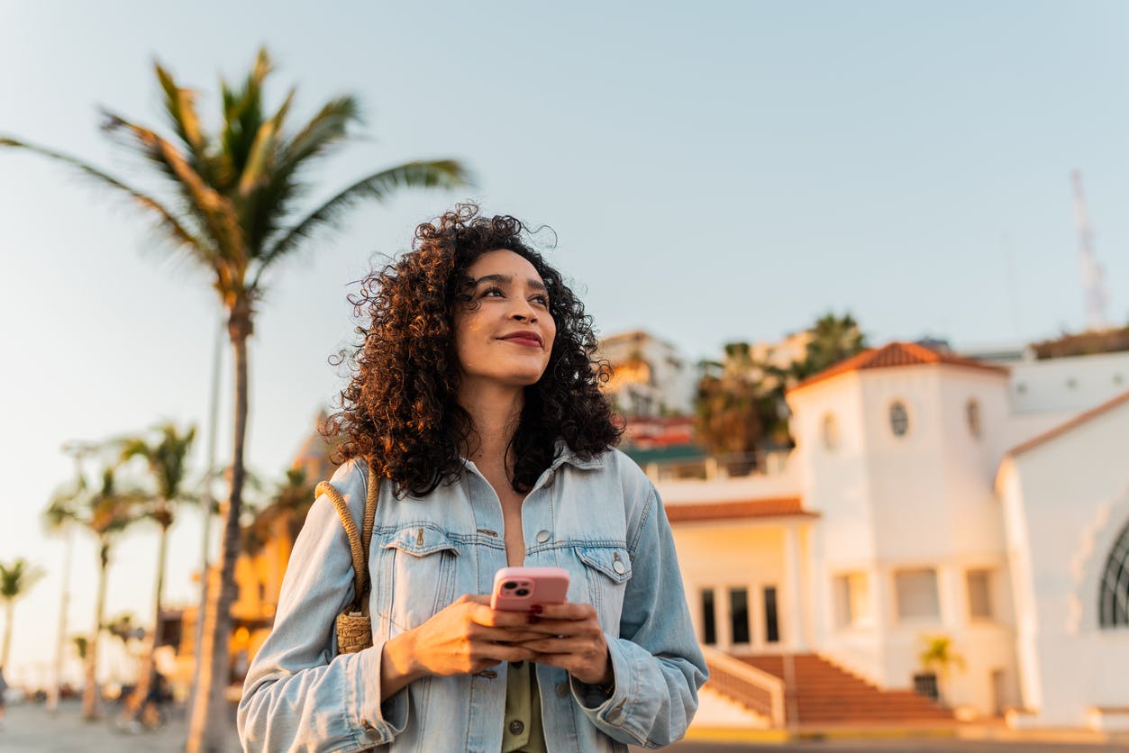 Woman with curly hair outdoors
