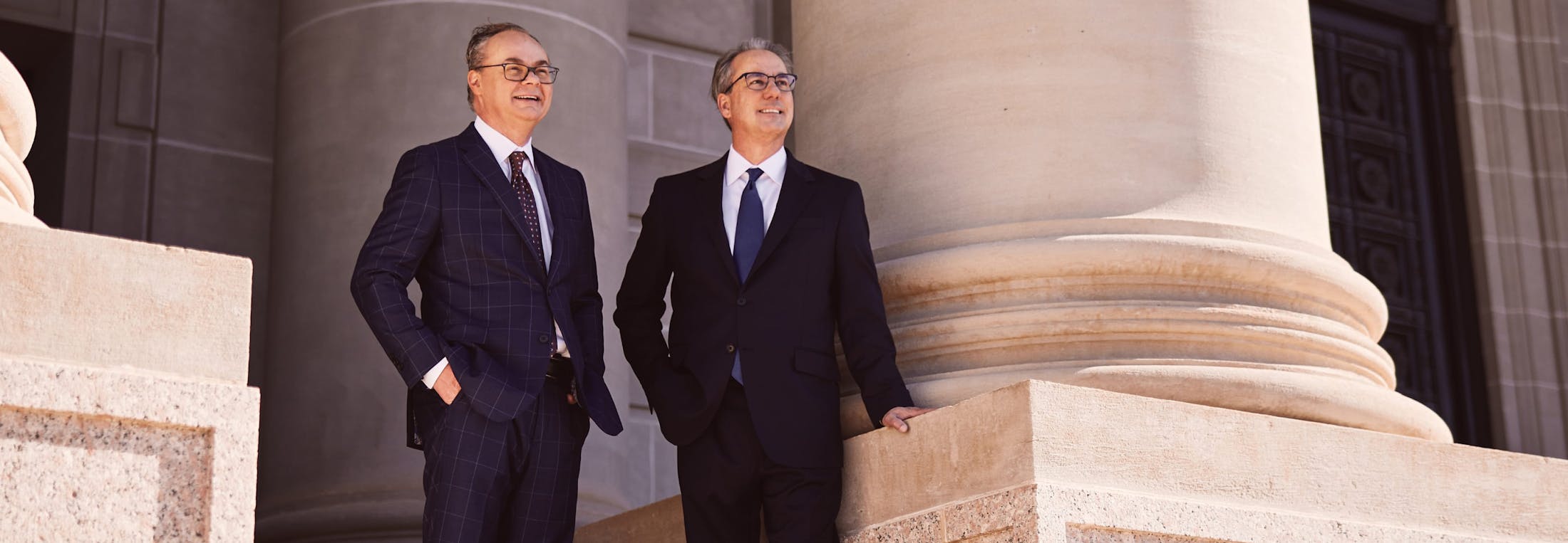 Lawyers Stipe & Belote standing in front of the court house.