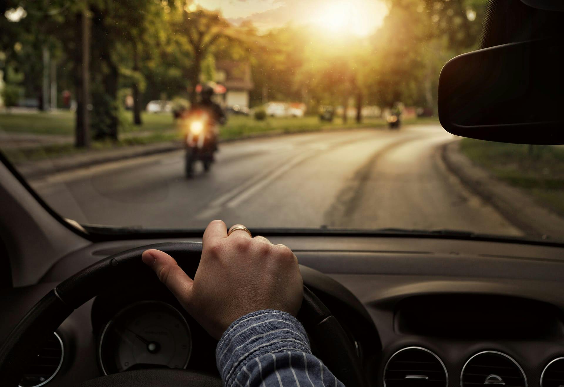 view of motorcycle from inside a car