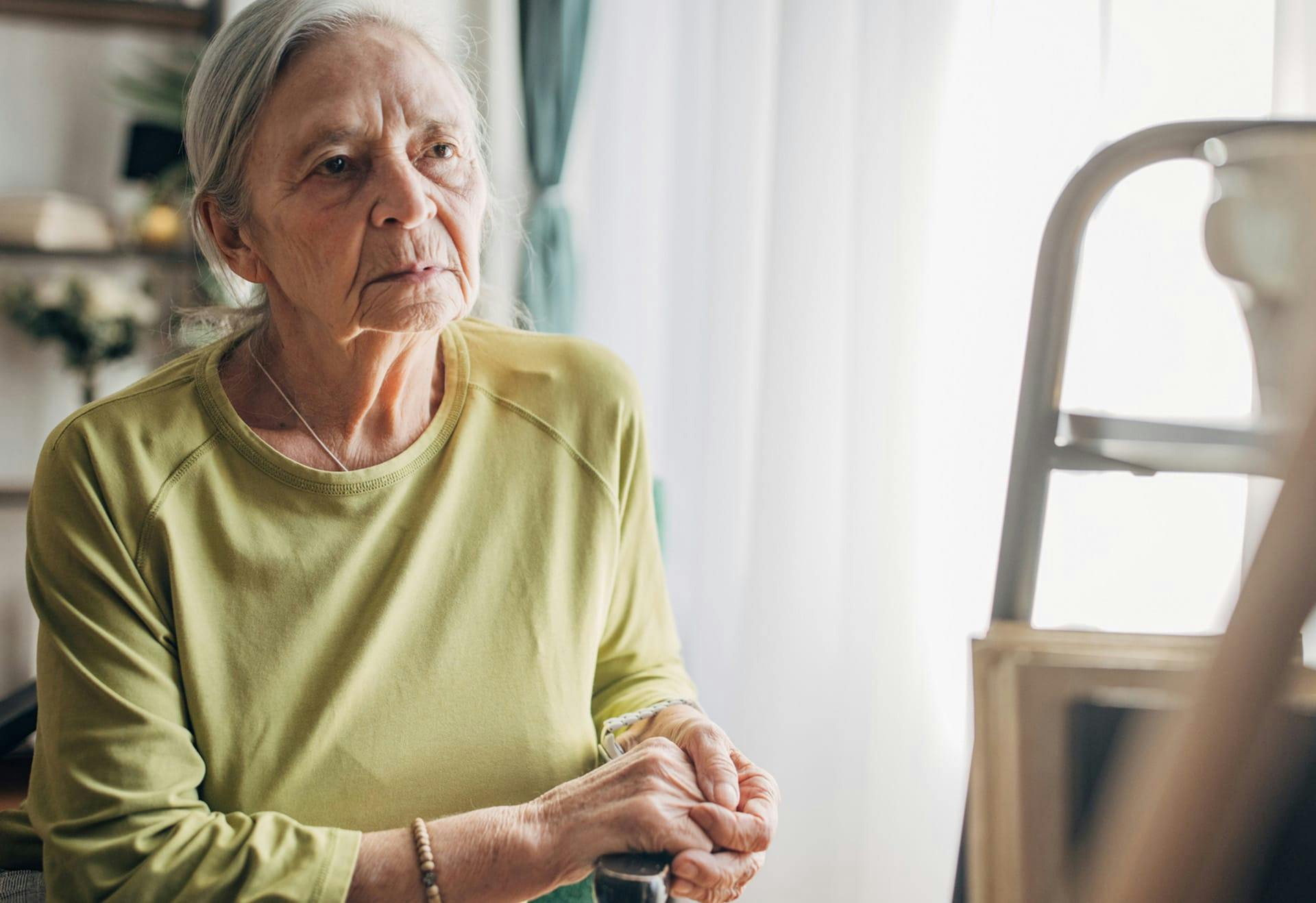 elderly woman in green shirt